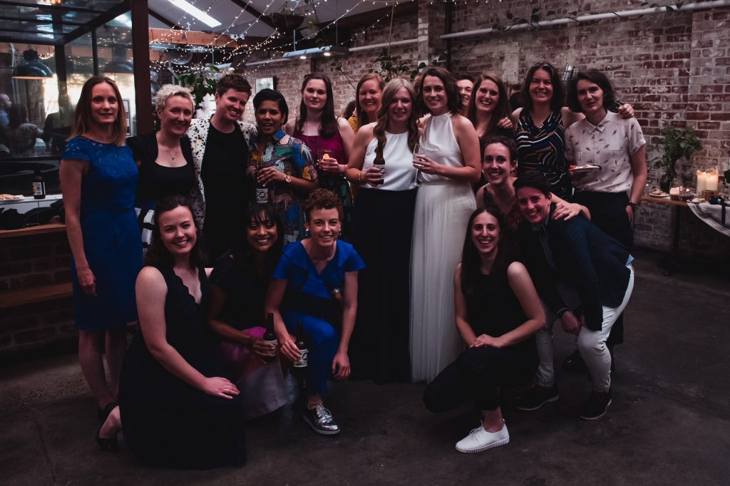 A group photo at Audrey and Keryn's wedding, featuring current MUSC players, former MUSC players and friends.